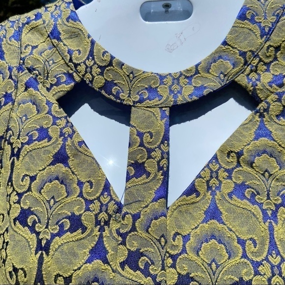 𝅺astr party dress of shimmering brocade with sexy cut outs. Figure flattering - Picture 1 of 6